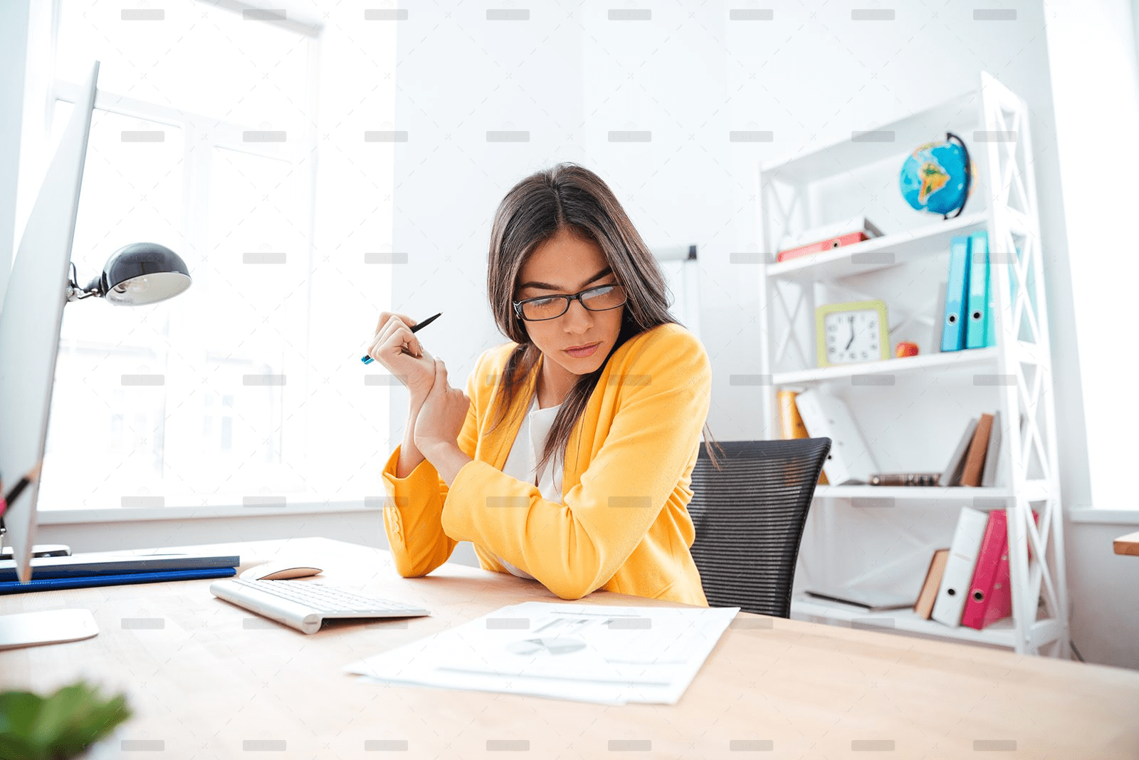 demo-attachment-449-businesswoman-analysing-document-P8WSNMC